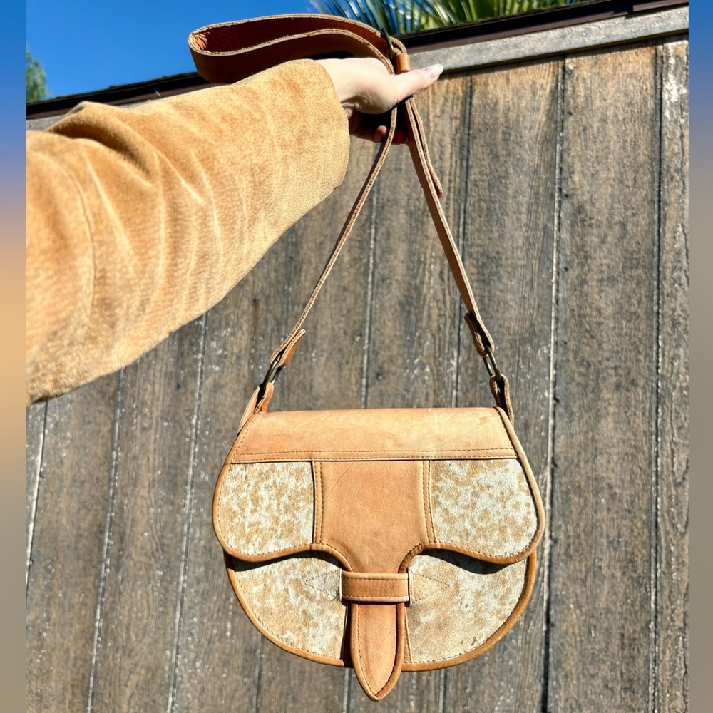Beautiful tan leather shoulder bag with cream and brown cowhide